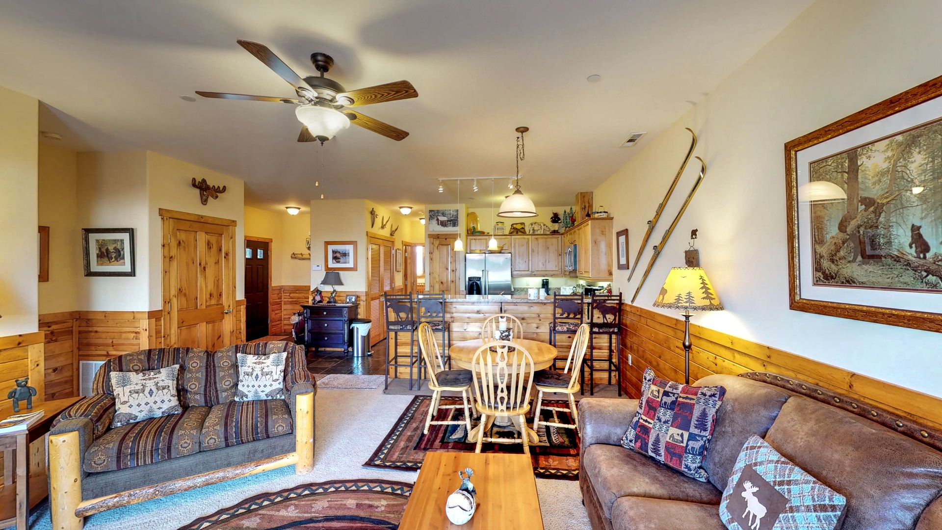 Living room with nearby kitchen and dinner table: Truckee Cinnabar Vacation Retreat