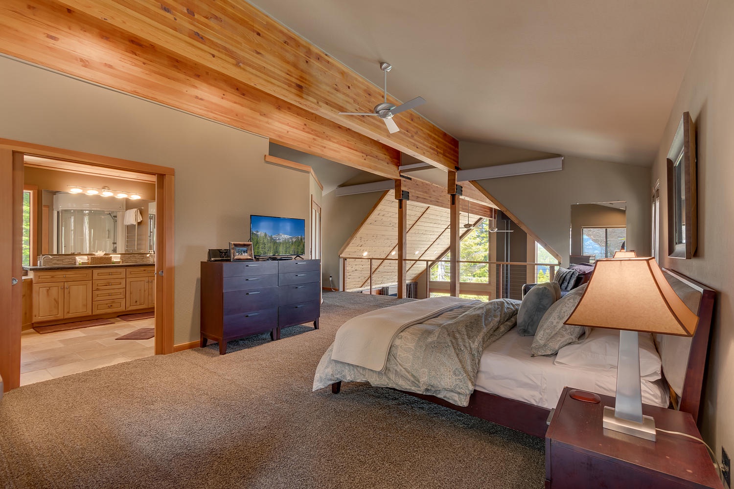 Bedroom with dresser and nearby bedroom: Falcon's Eye View Retreat