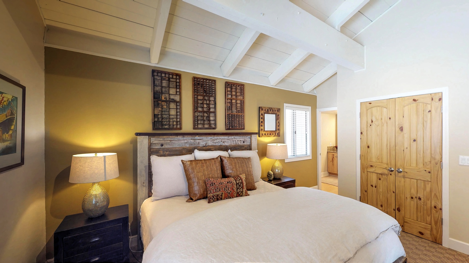 Bedroom with two nightstands and nearby closet: Eagle's Nest Lodge