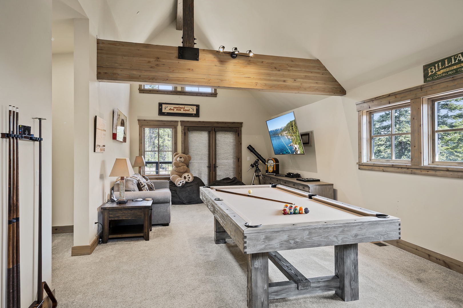 Upper Floor: clubhouse area with a pool table, wet bar, arcade game and second living room