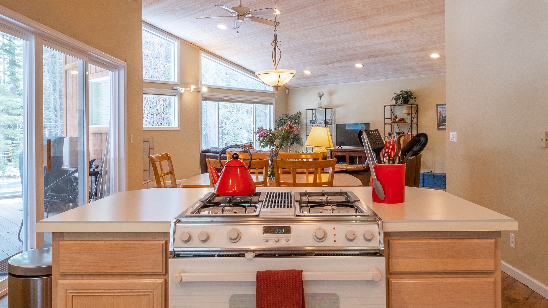 Kitchen Stovetop into Dining Room: Three Pines Family Cabin