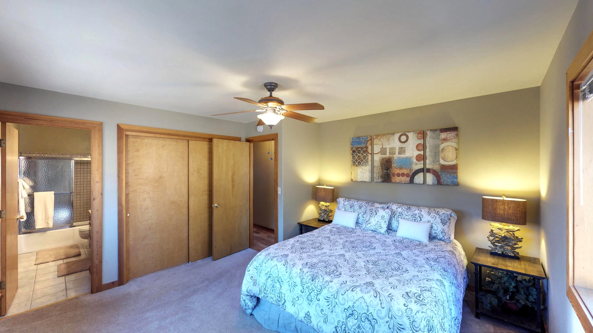 1st Bedroom with Queen Bed and Attached Bathroom: Wolfgang Vacation Cabin