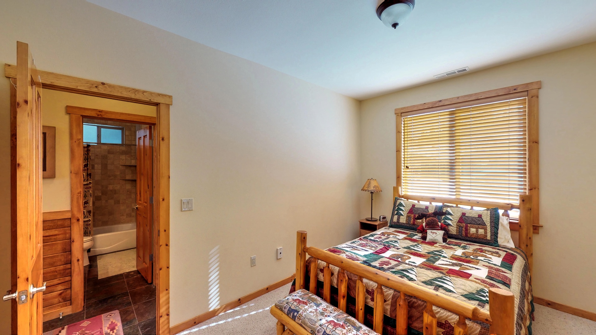 Bedroom with tan walls and nearby bedroom: Truckee Cinnabar Vacation Retreat