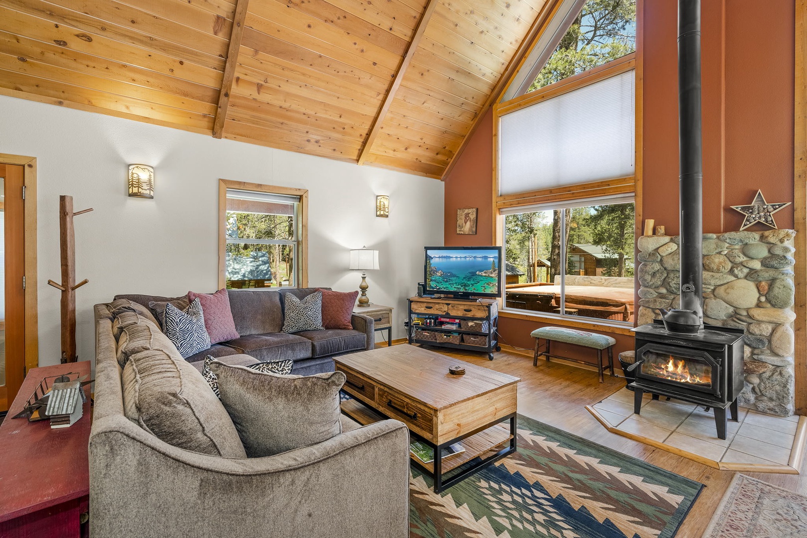 Tv room with wood fireplace: Tahoe Donner Creek Side Retreat with Hot Tub