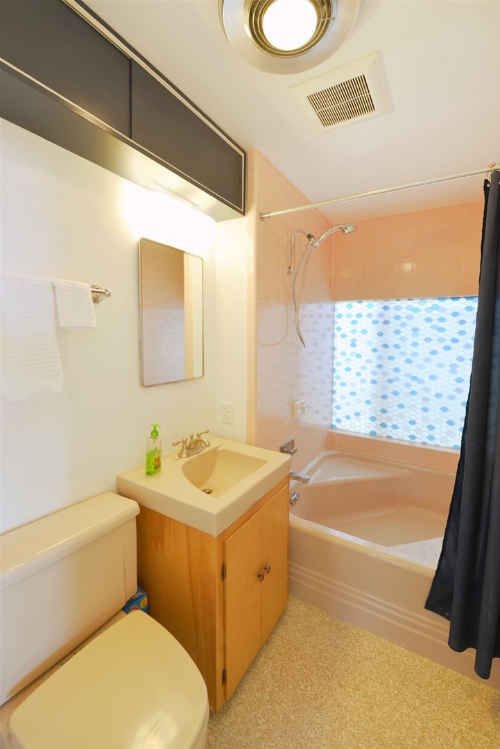 This full bath is off the hallway near bedrooms 3 and 4.