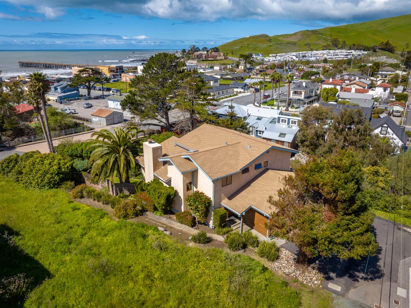Creekside Charm The backyard and balconies full of afternoon sun.