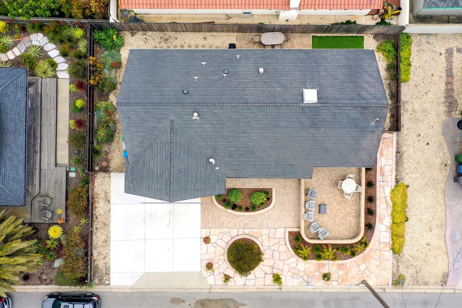 Arial view of the home showing the nicely landscaped yard and front patio