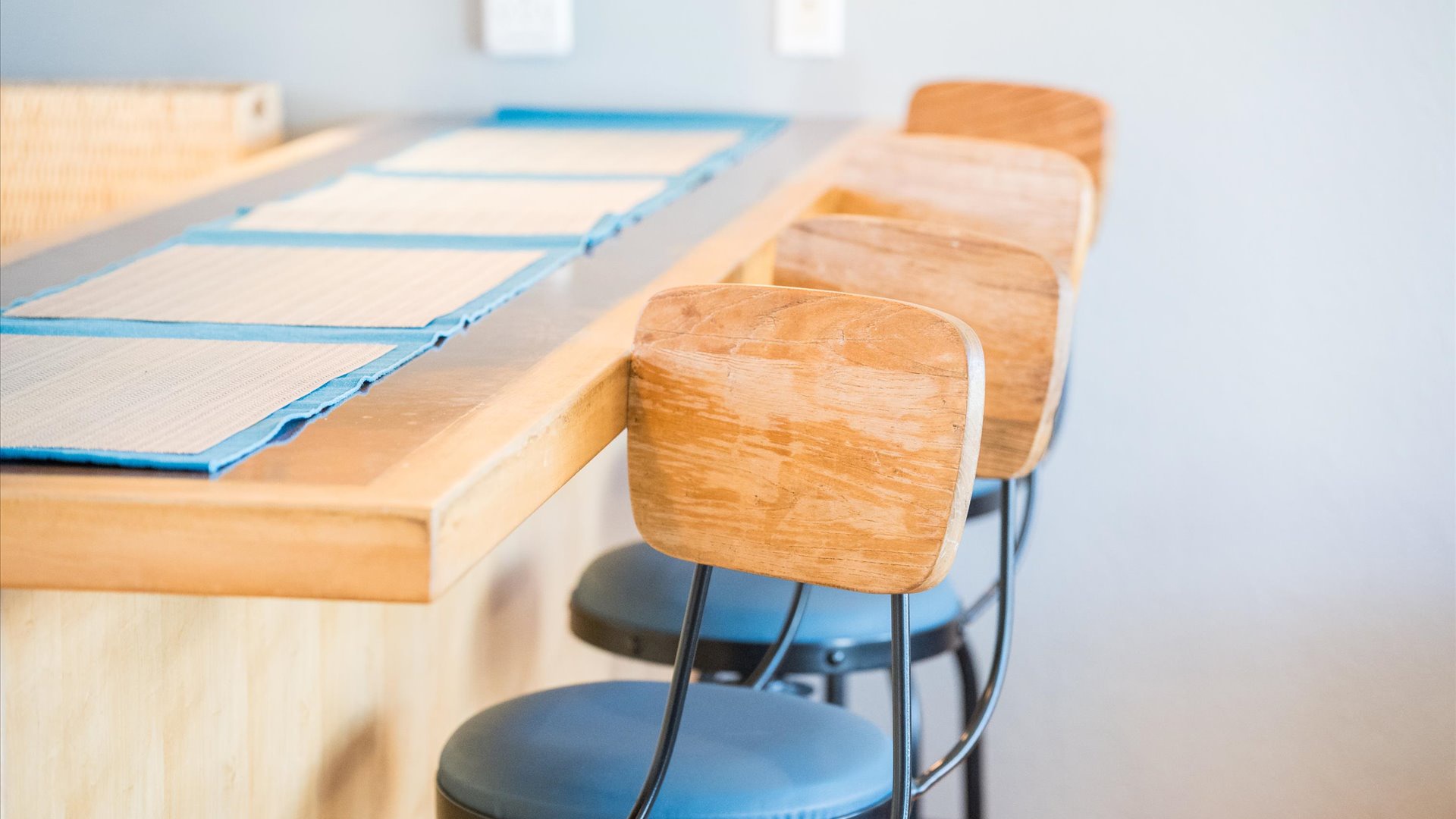 Pull up to your kitchen counter on stylish wood-backed stools for morning coffee or casual meals together.