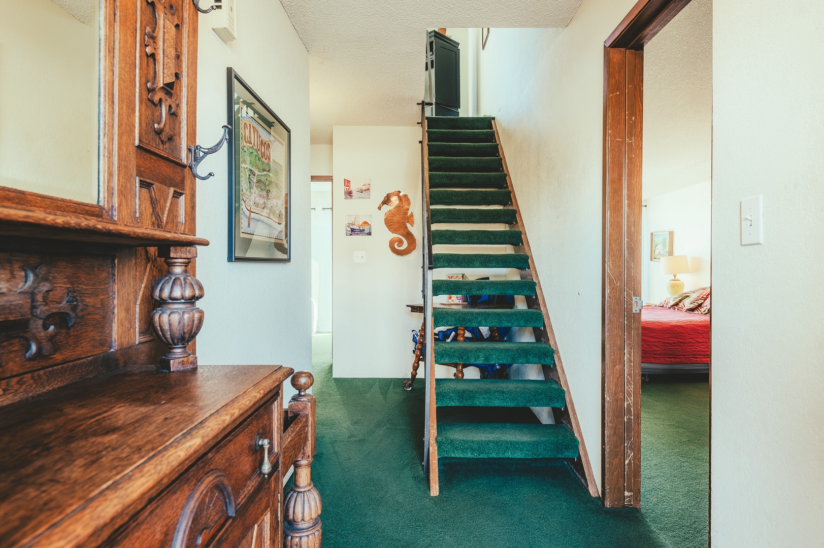 Step into your charming retreat where rich wooden details and nautical touches create a warm, inviting atmosphere that feels like home.