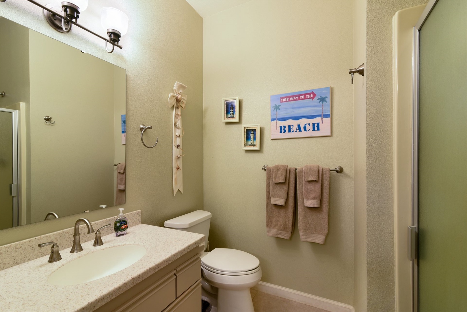 The adjoining master bath has a step in shower