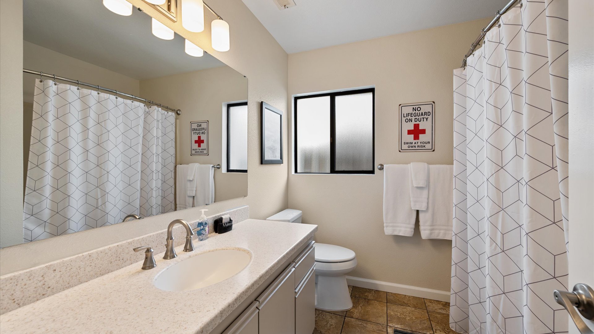 Second bathroom is located off the hallway with a shower/tub combination