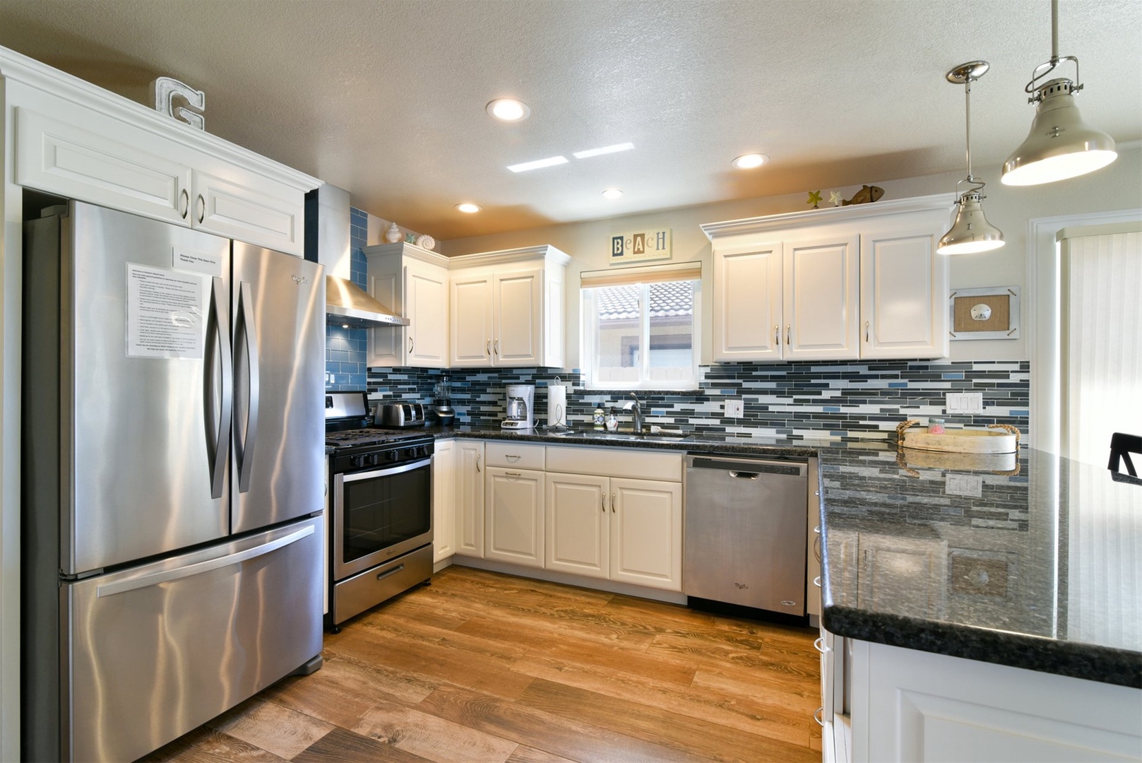 This kitchen boasts all the modern appliances.