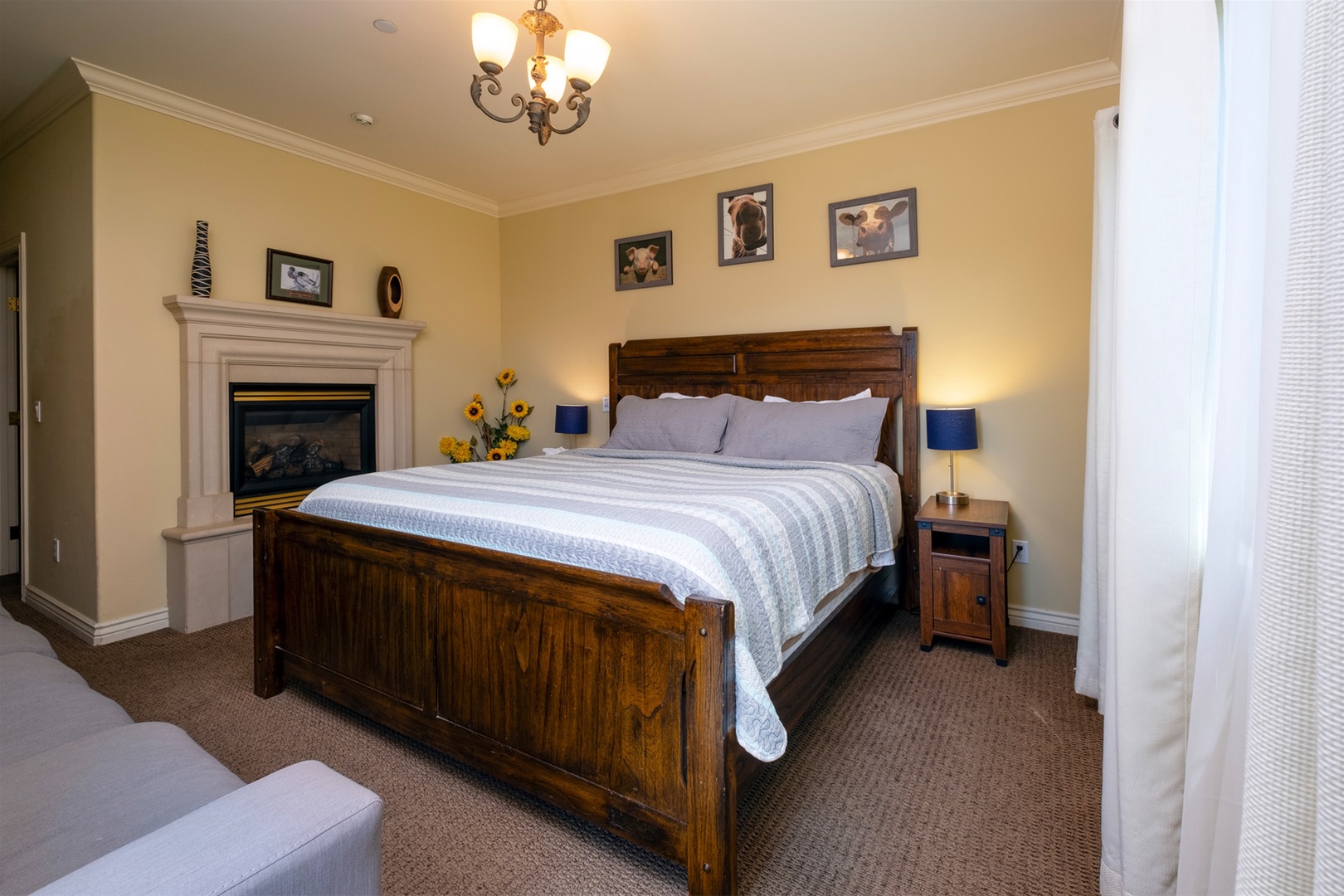 Master bedroom has a king bed, fireplace and access to the balcony