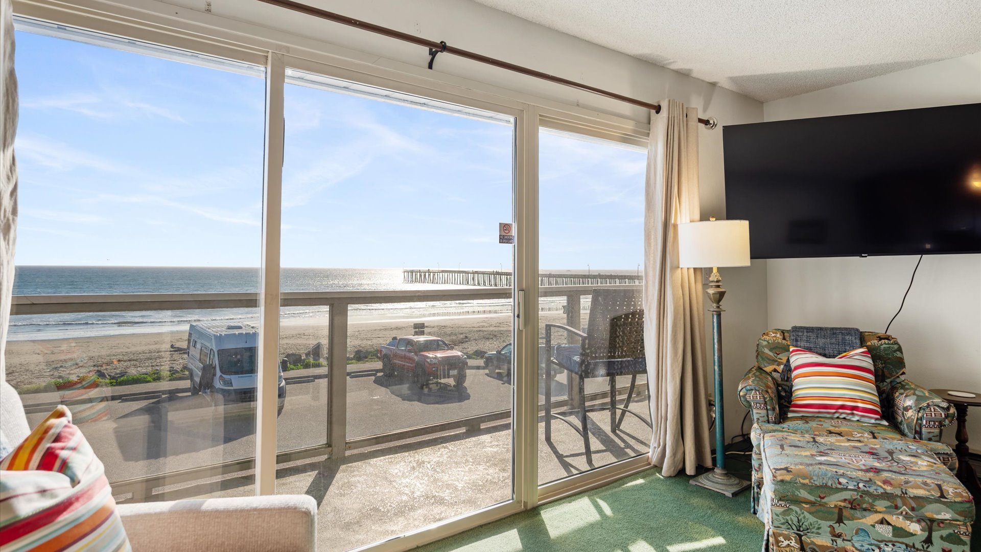 Living room features a large flat screen tv for after the sun sets and it's time to unwind