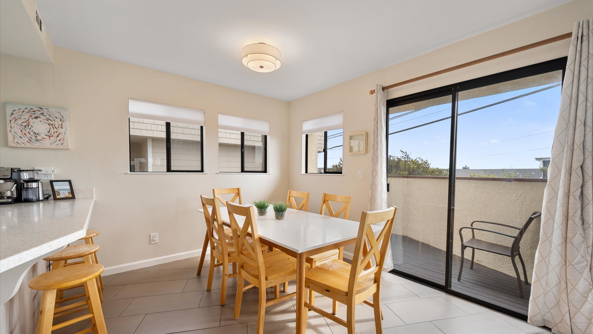 Gather around the dining table for memorable meals, with kitchen counter space nearby and your own private balcony for morning coffee.