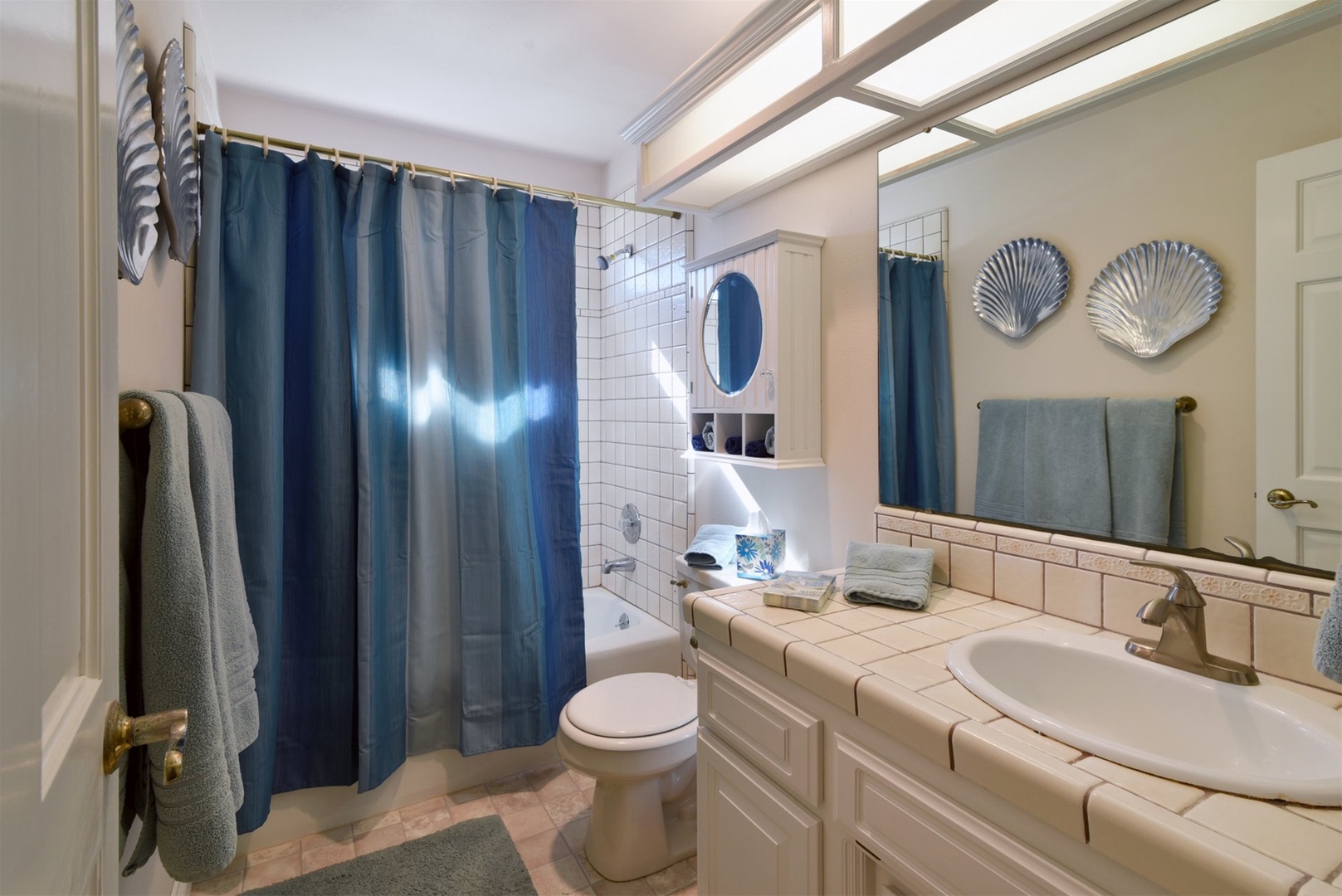 The second downstairs full bathroom with tub/shower combo is shared between the 2nd and 3rd bedrooms