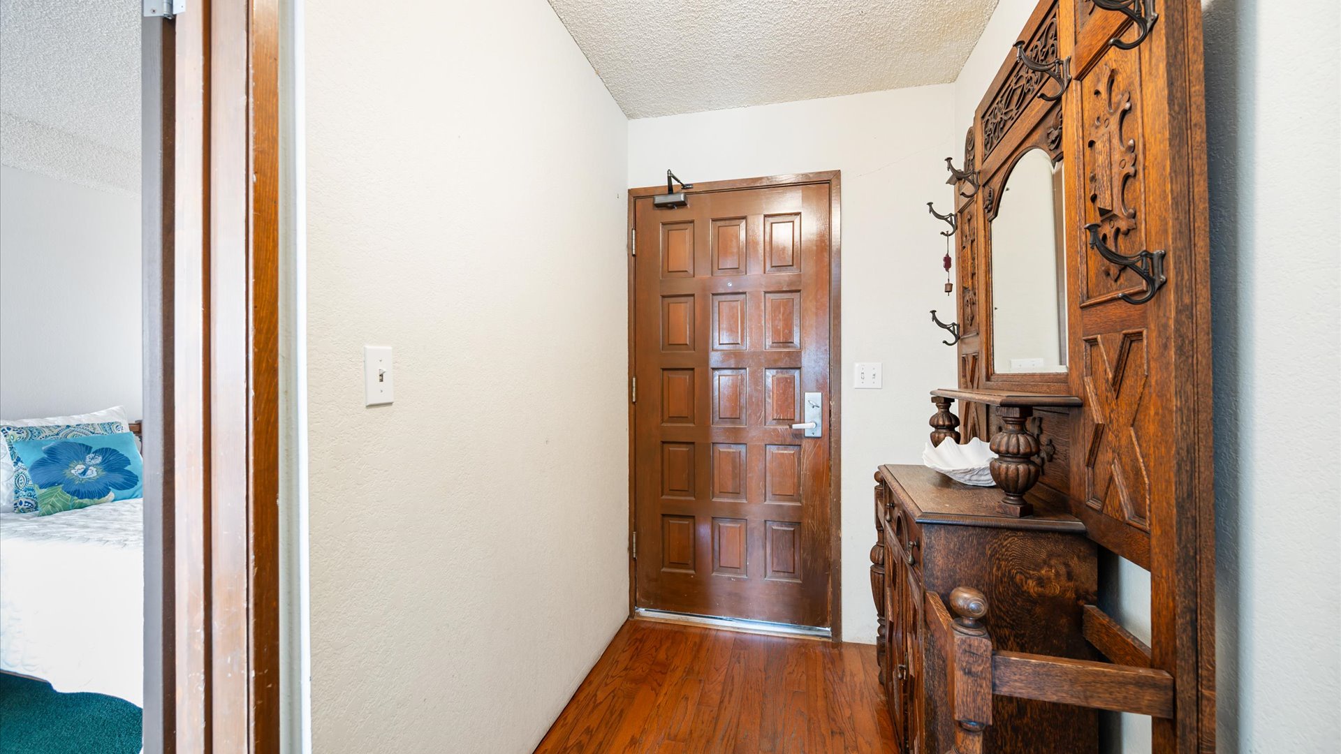 Entry to the home showcases the rich woods and ornate furnishings that add timeless charm to your vacation