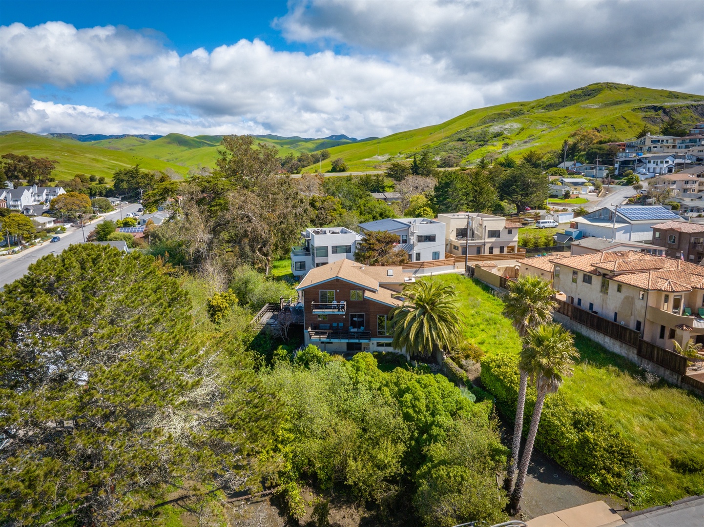 Surrounded by trees and a vacant lot, make this creekside cottage your home away from home 