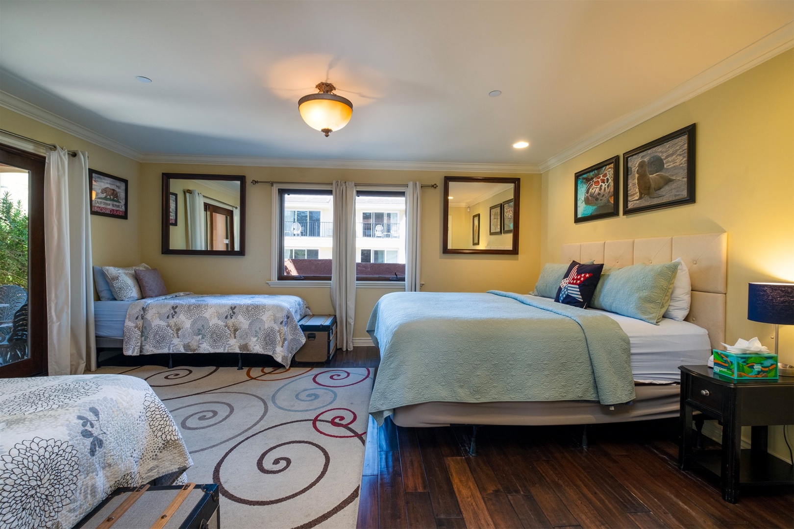 Downstairs bedroom with king bed and 2 twins