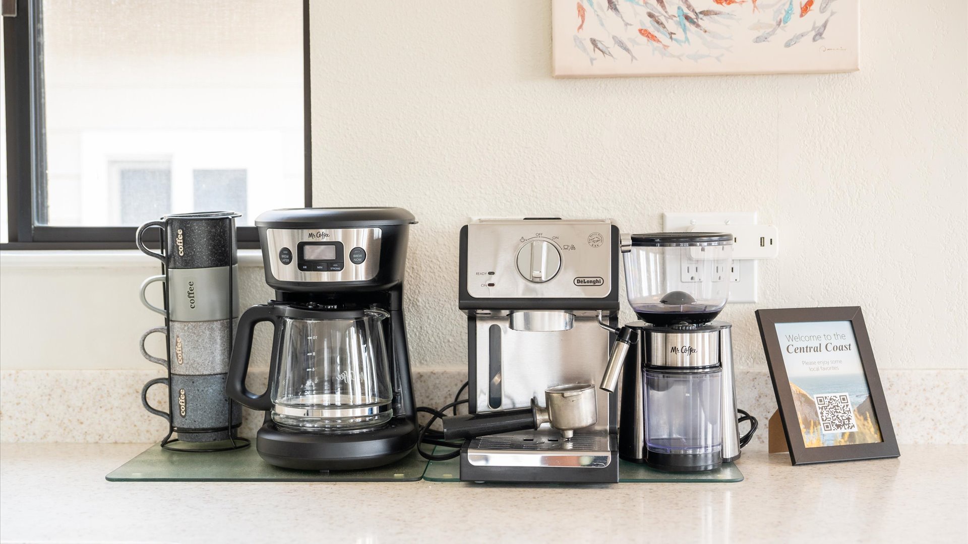 Start your mornings right with this coffee station featuring espresso machine, drip coffee maker, and grinder for perfect brews.