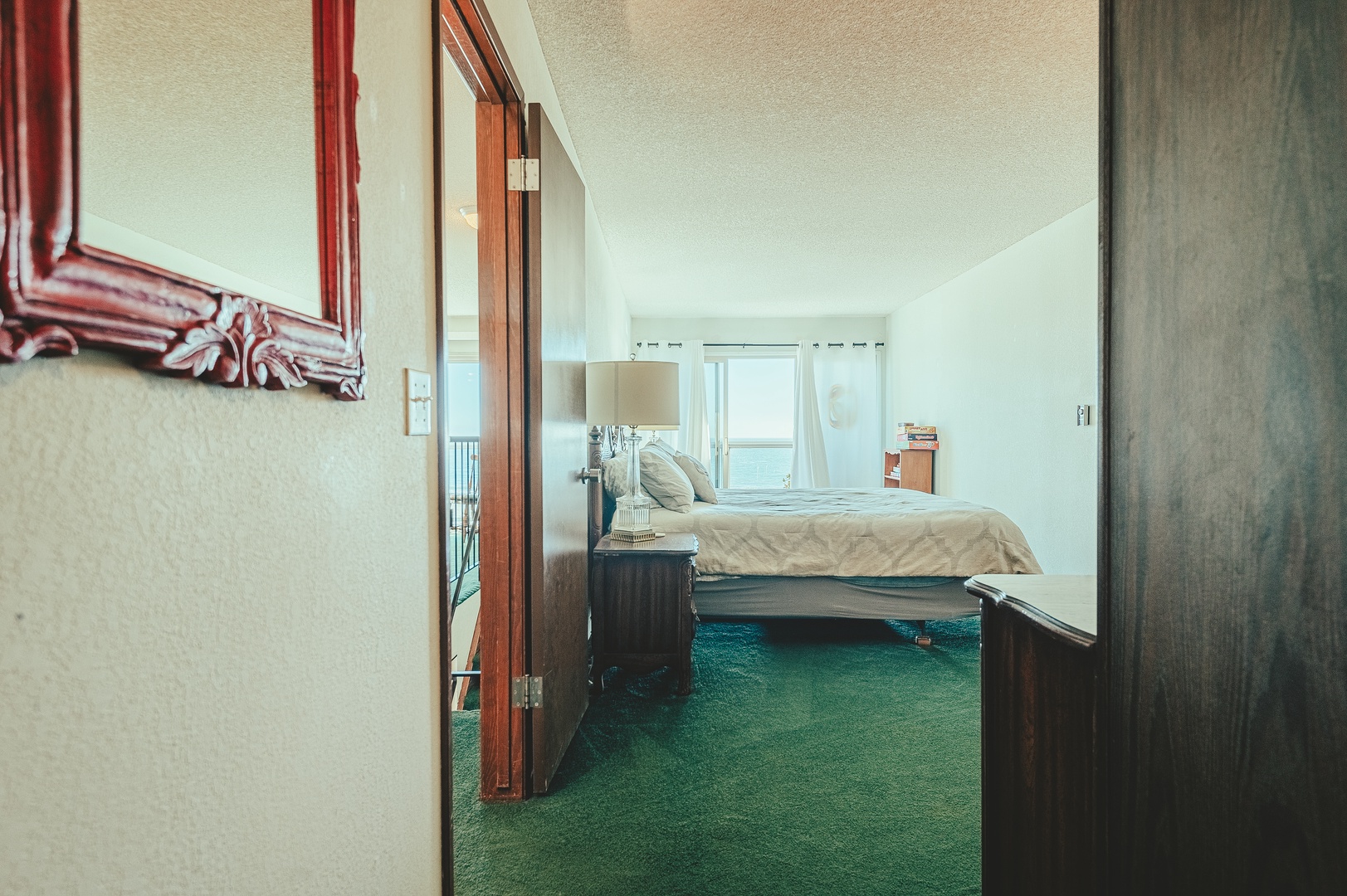 The Master bedroom features a King sized bed and private balcony with ocean views