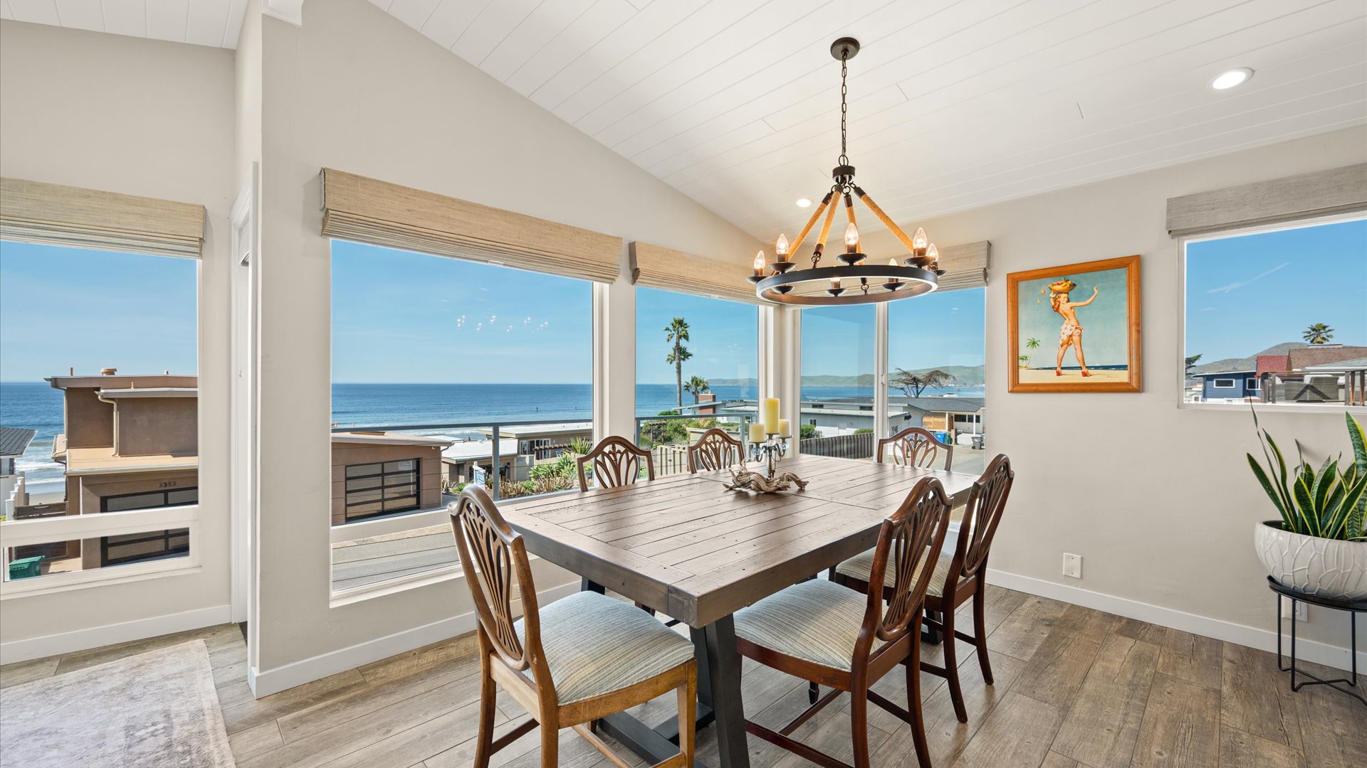 Gather around the dining table where ocean views and beach breezes create the perfect backdrop for your meals.