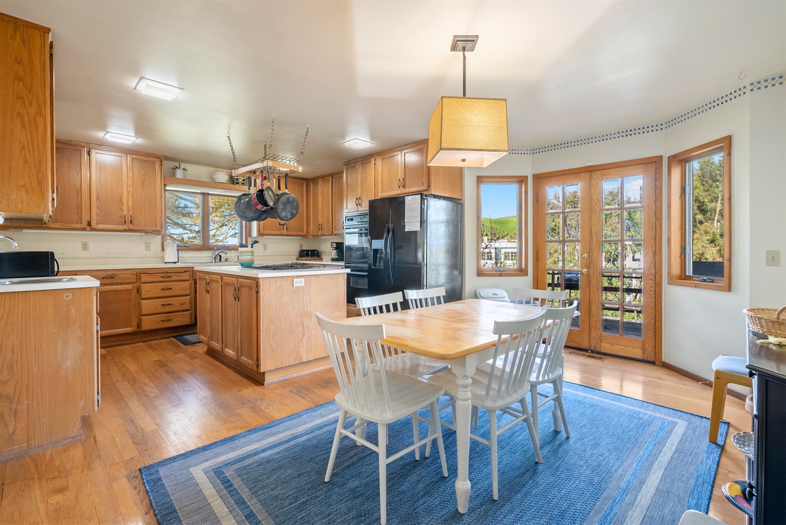 A second dining table is near the kitchen.