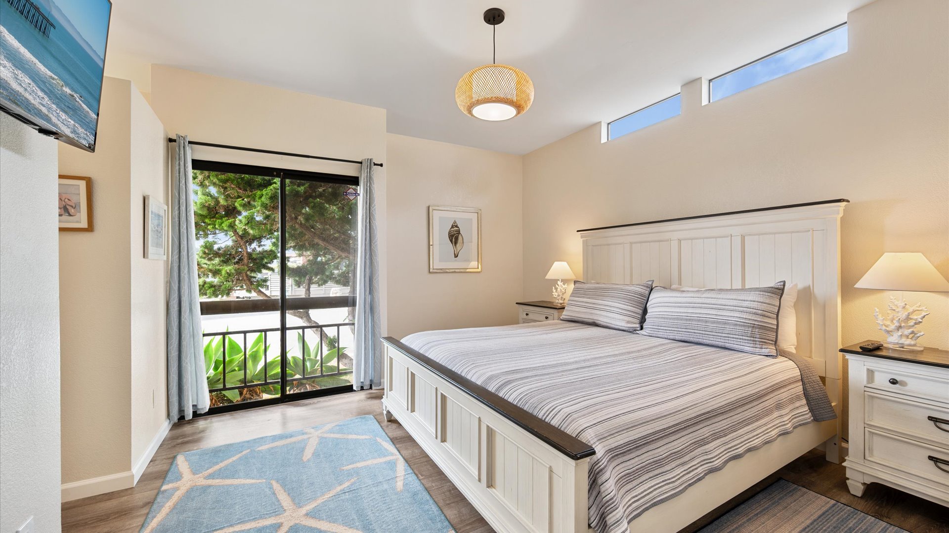 Master bedroom features a King bed and sliding glass door to open and enjoy the refreshing ocean breeze