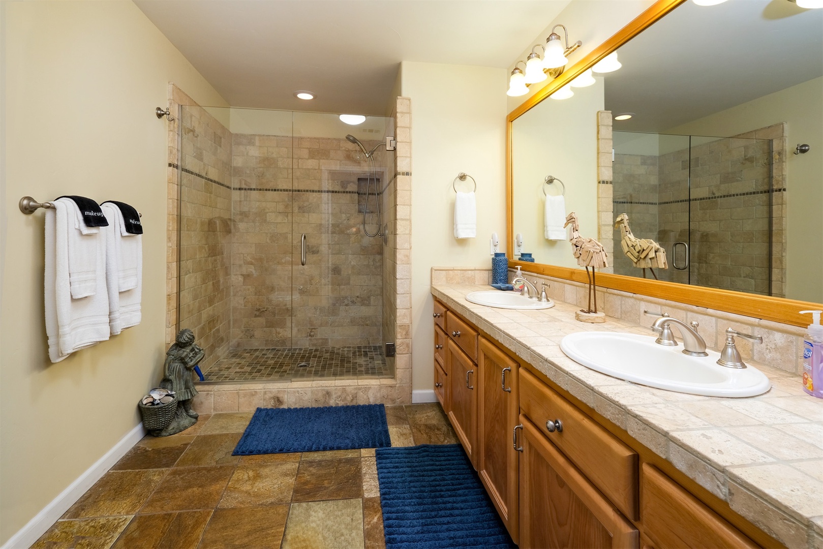 The master bath has a large step in shower and double sinks.