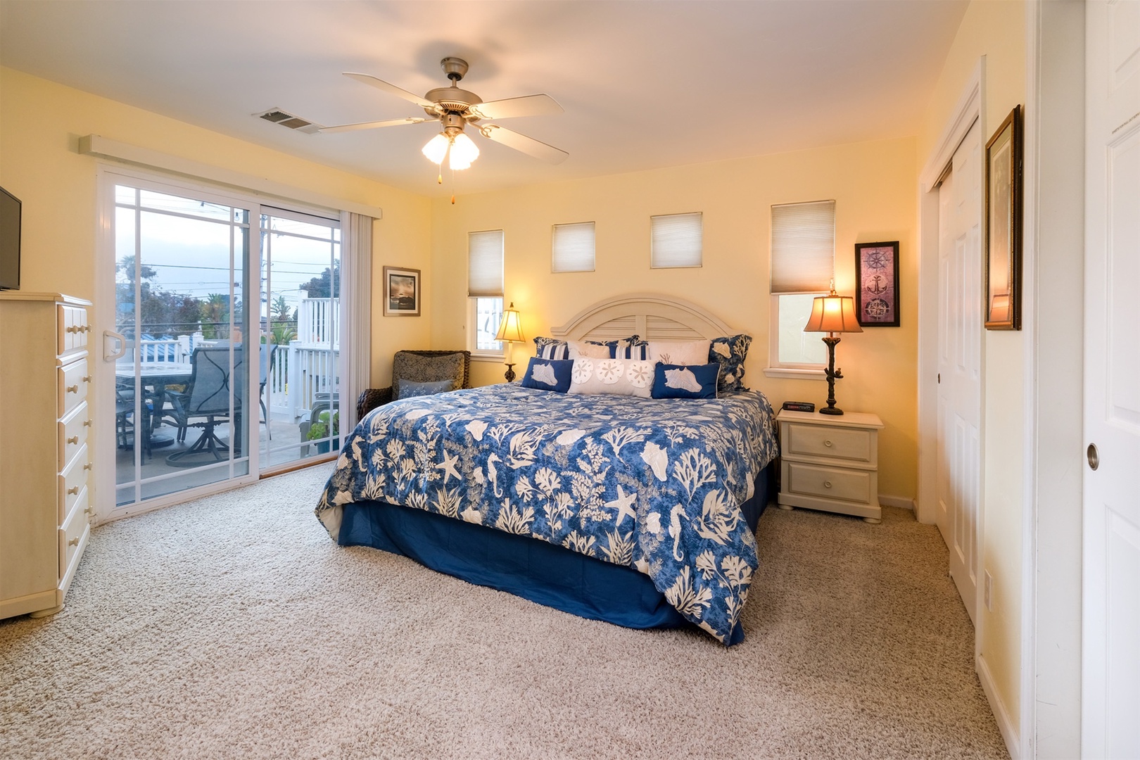 The large master bedroom has a King bed, flat screen tv, and access to the balcony.