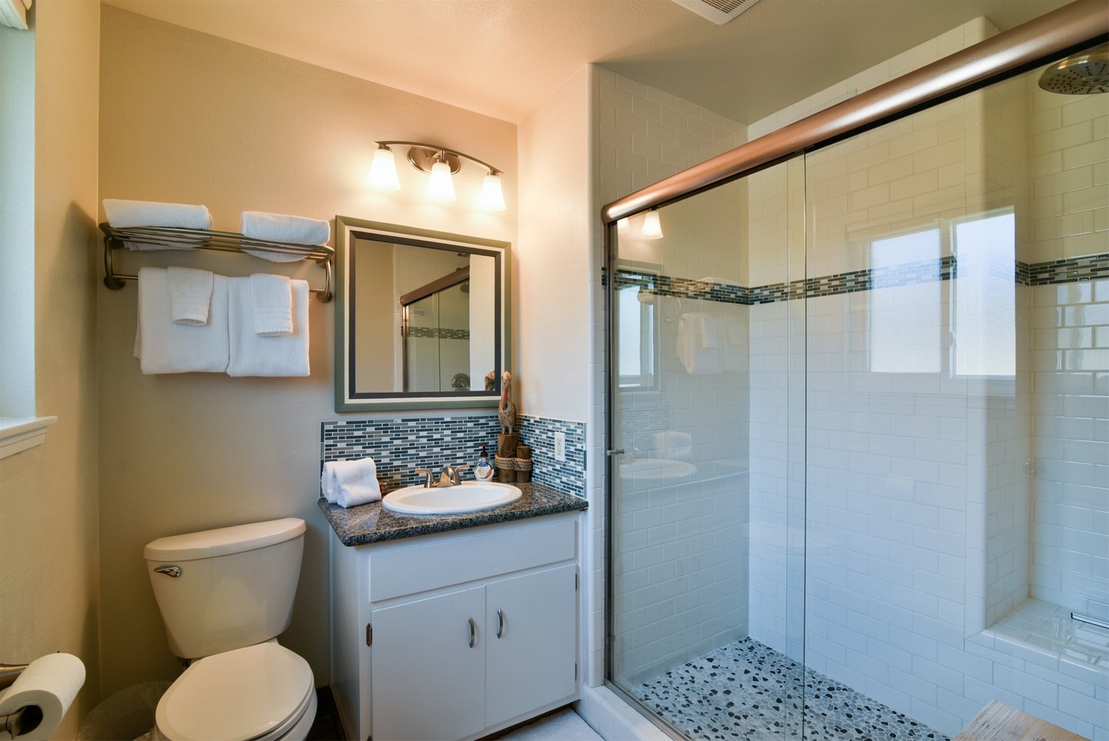 Master bathroom with updated tile and shower seating