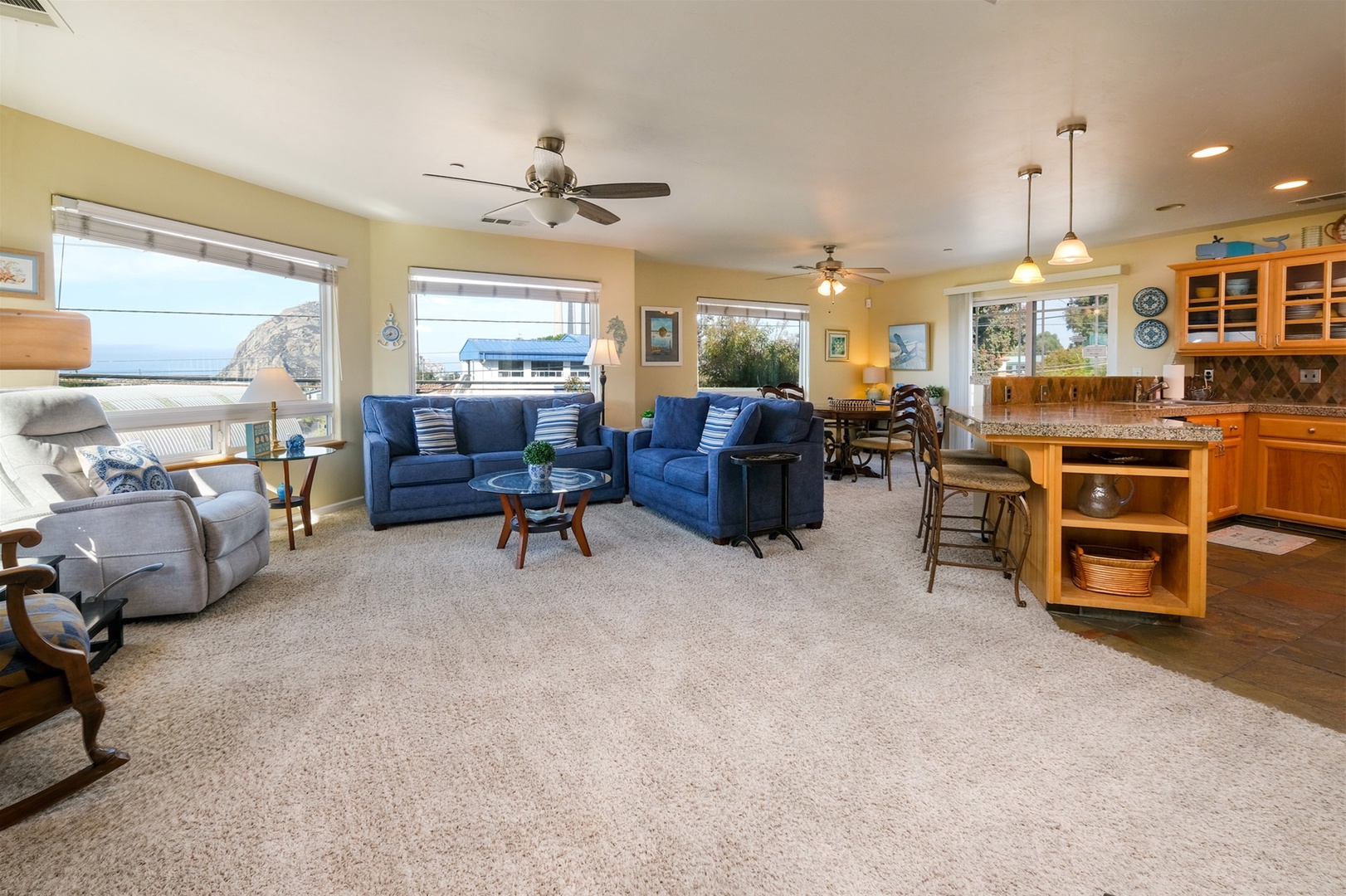 The living space has large windows with great light. The patio doors open to the balcony.