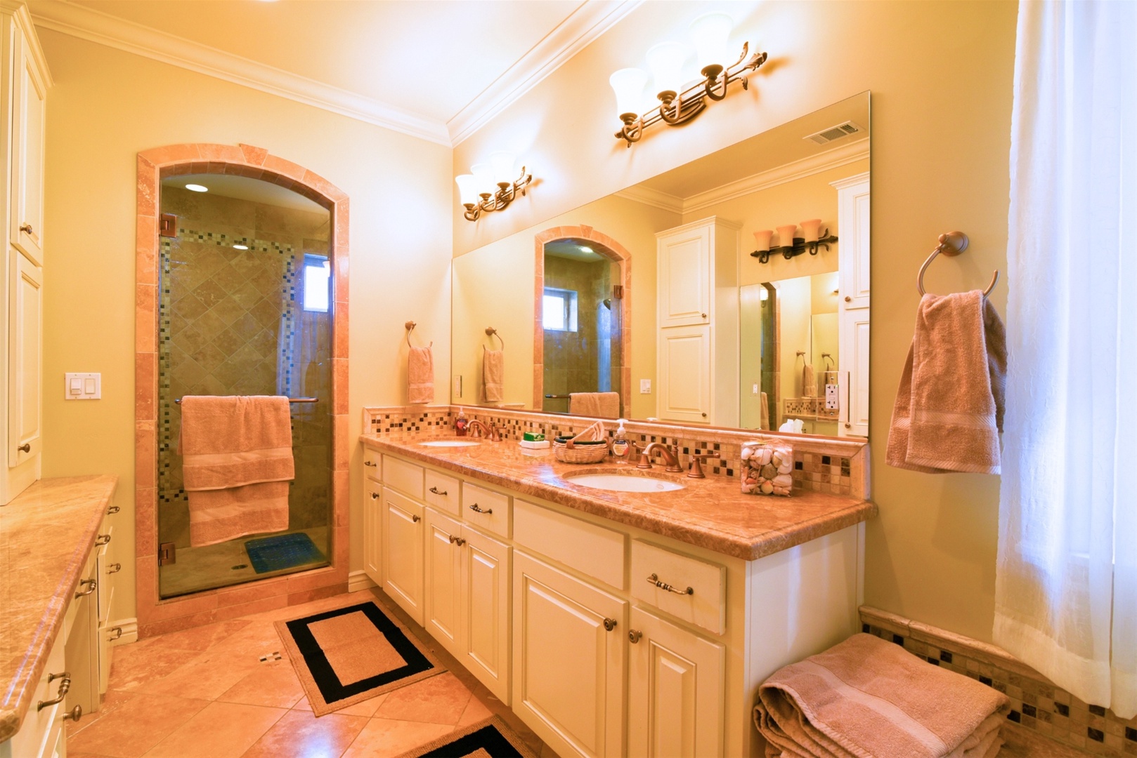 Spacious adjoining master bath with jet tub and step in shower