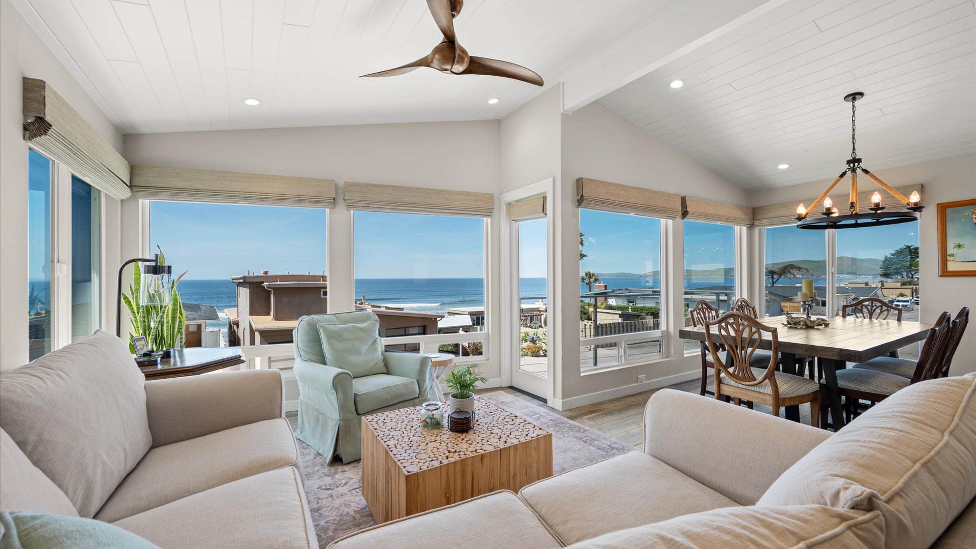 This home showcases panoramic ocean views through floor-to-ceiling windows