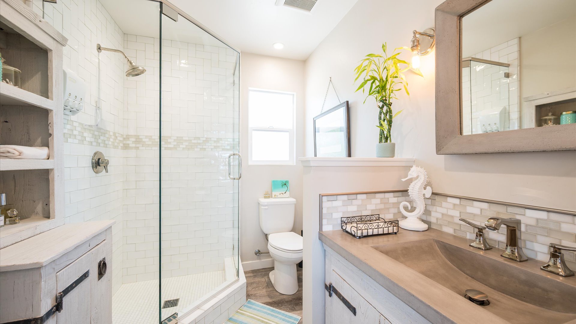 Upstairs full bathroom features a lovely step in shower