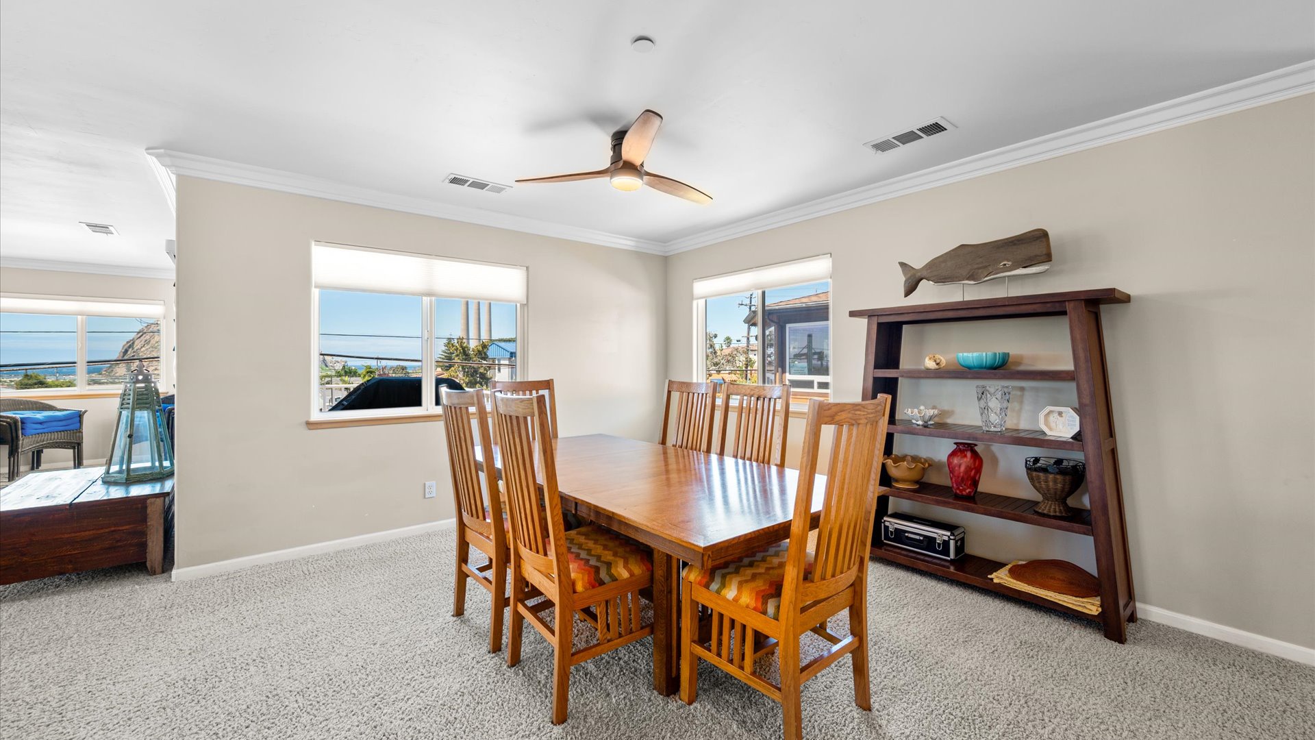 Spacious dining area with table and seating for the whole group, open to the living and kitchen areas