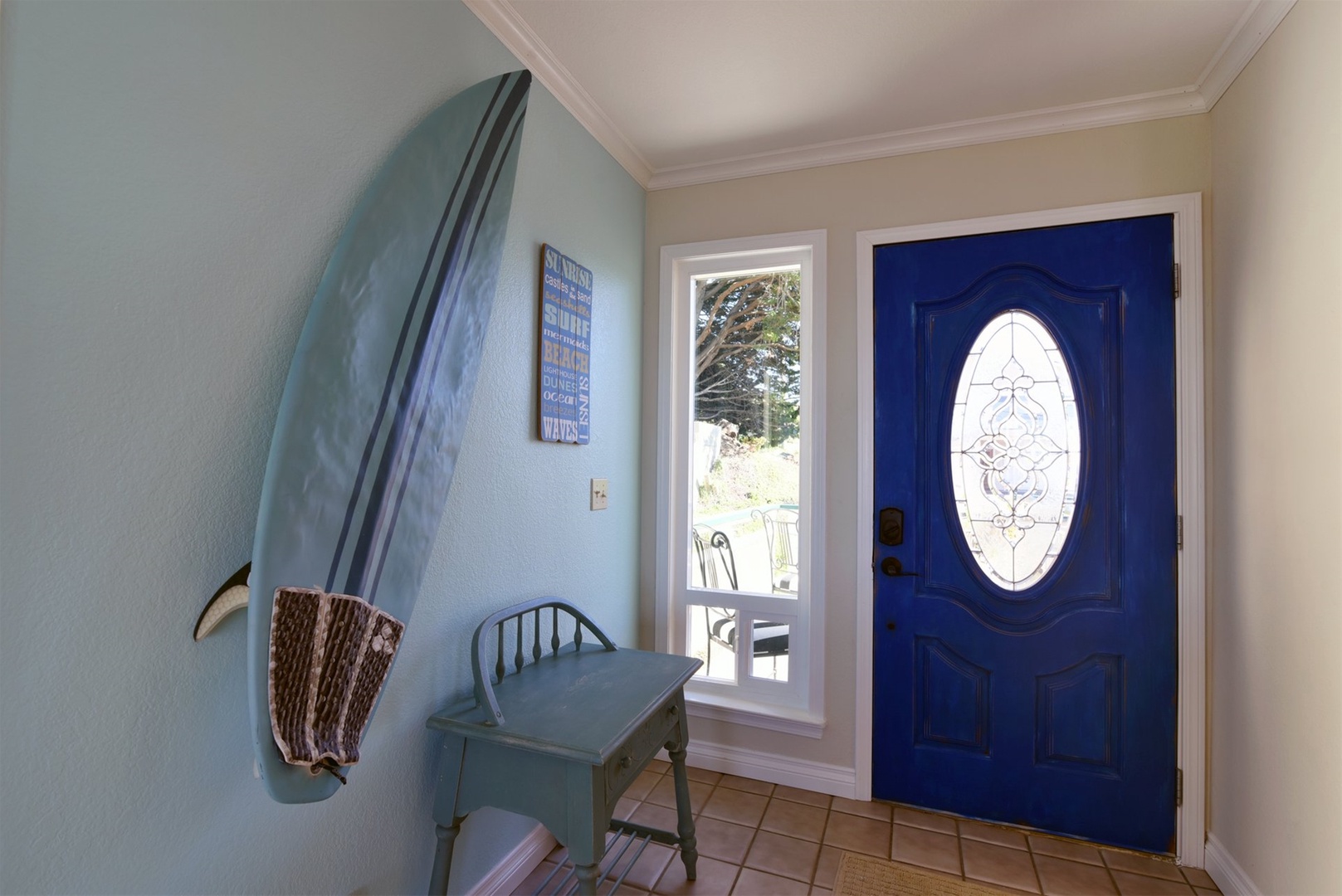 Foyer to main floor and streetside outdoor patio.
