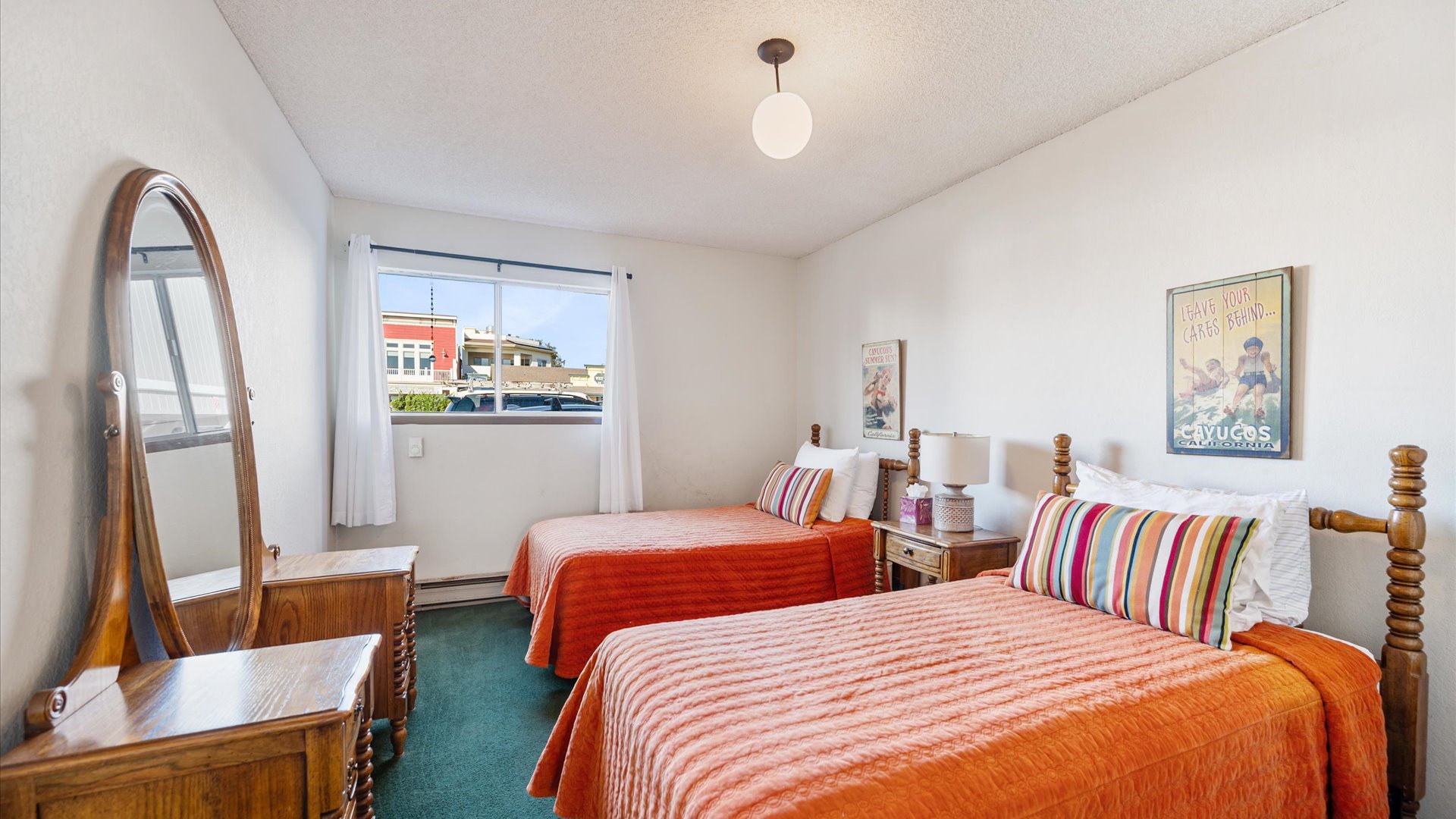 Downstairs the second bedroom features two twin beds