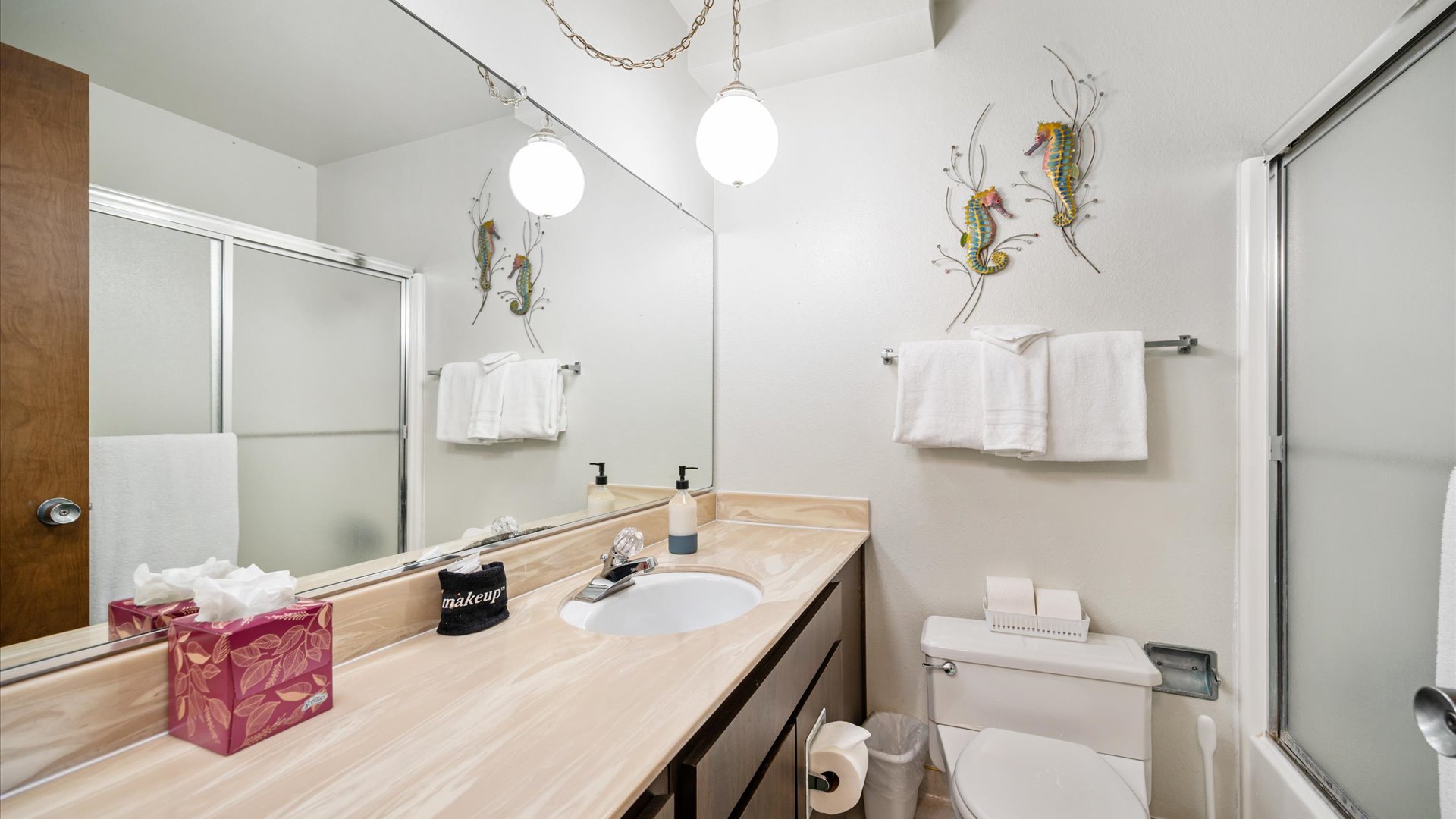 Downstairs hall bath features a shower/tub combination