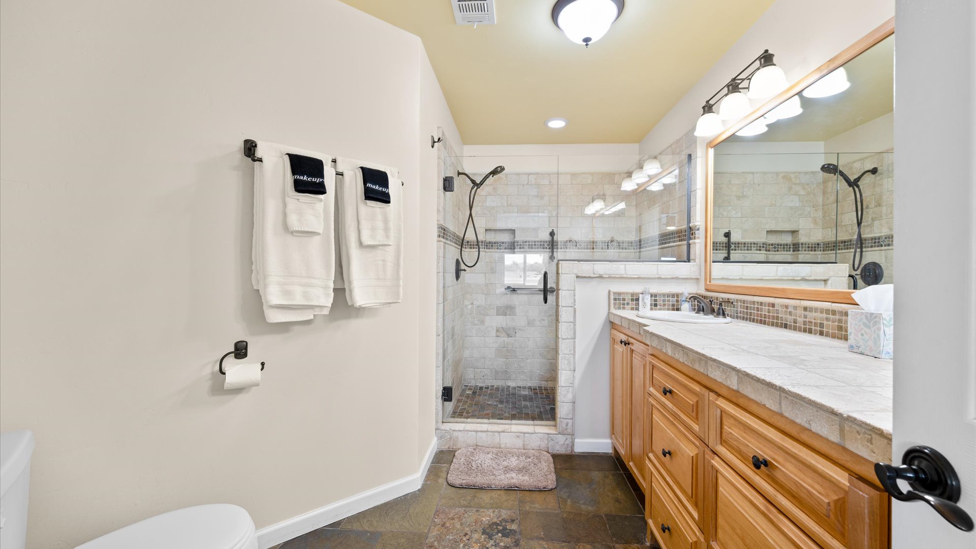 Spacious master bathroom with large step in shower and vanity