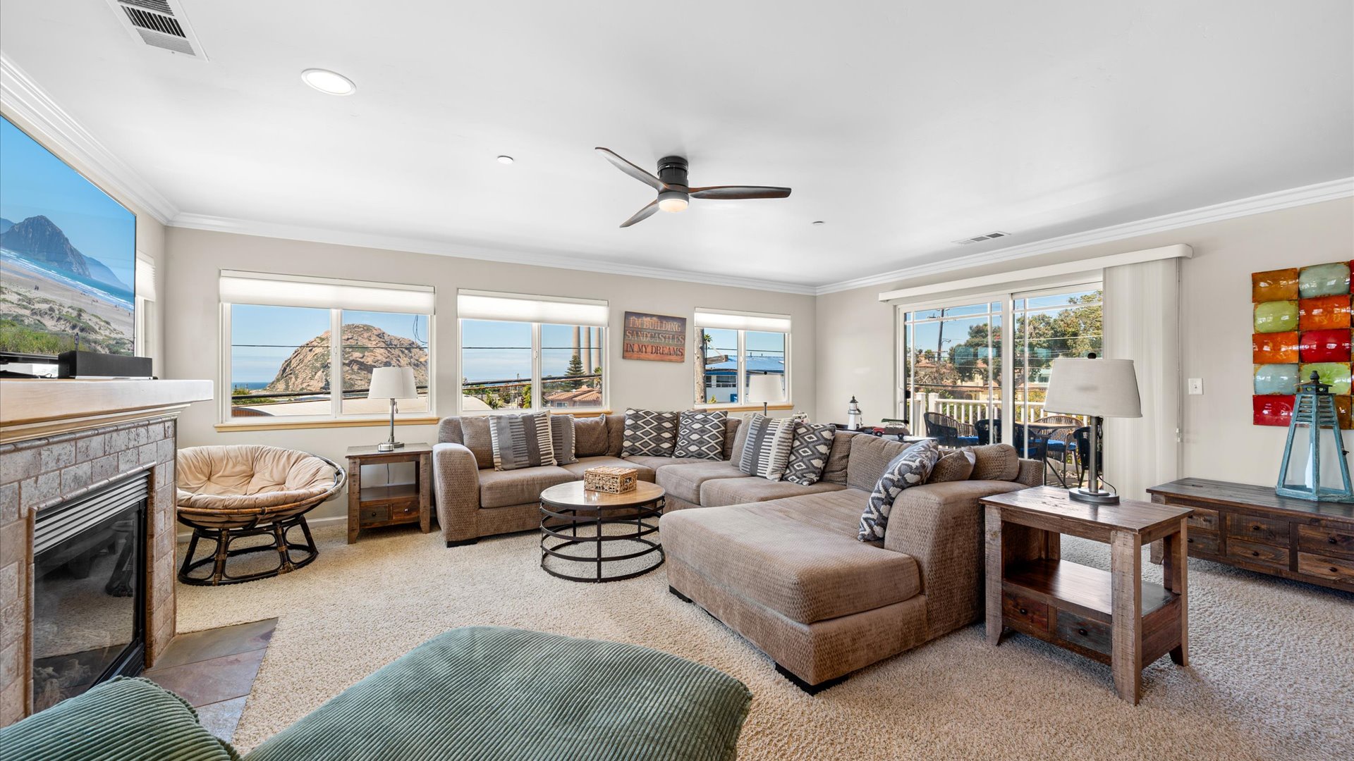 Relax in your spacious living room with large, cozy sectional couch while taking in the views