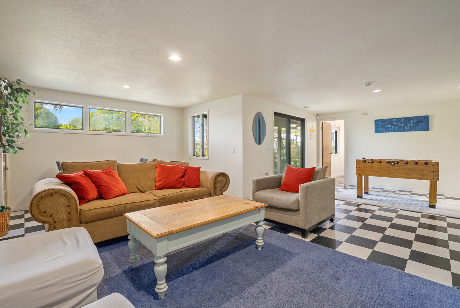 Head downstairs to the bottom floor to find a den and game room