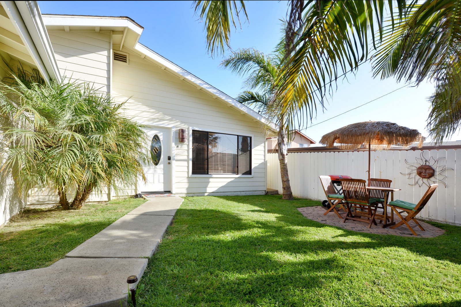 You will feel like it`s a tropical paradise hanging out in the front yard with the amazing mature palm trees.