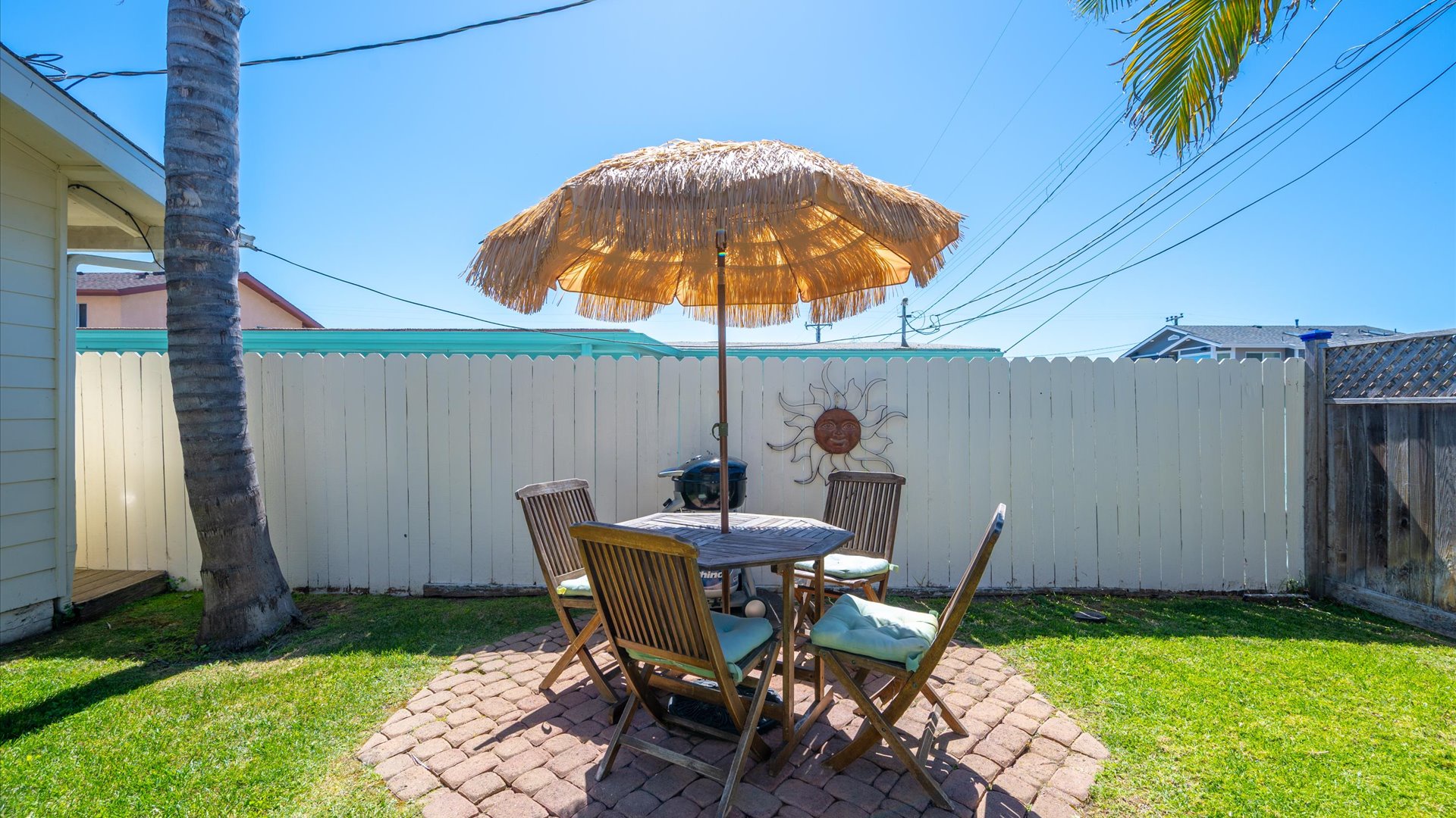 Relax at your private outdoor dining spot in the fully fenced front yard