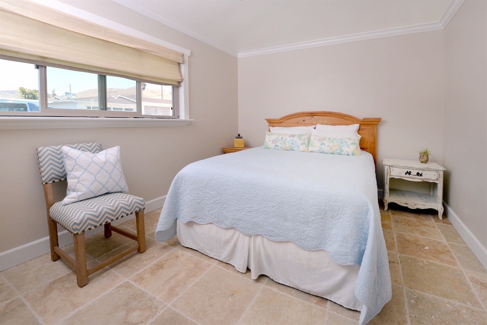 The second bedroom is handsomely decorated and includes a queen bed.