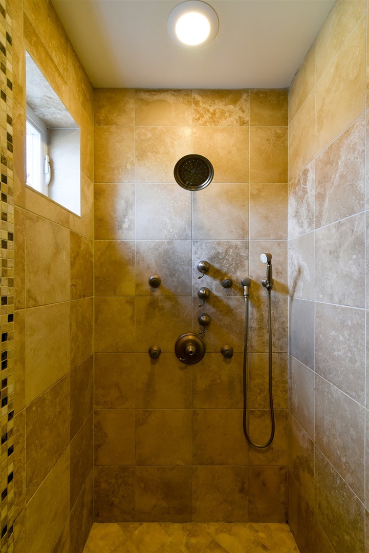tiled step in shower in the master bath