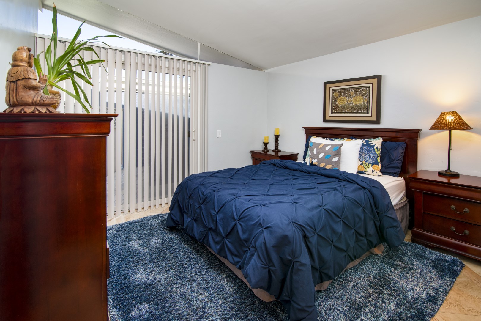 Second bedroom with a queen bed and access to the patio