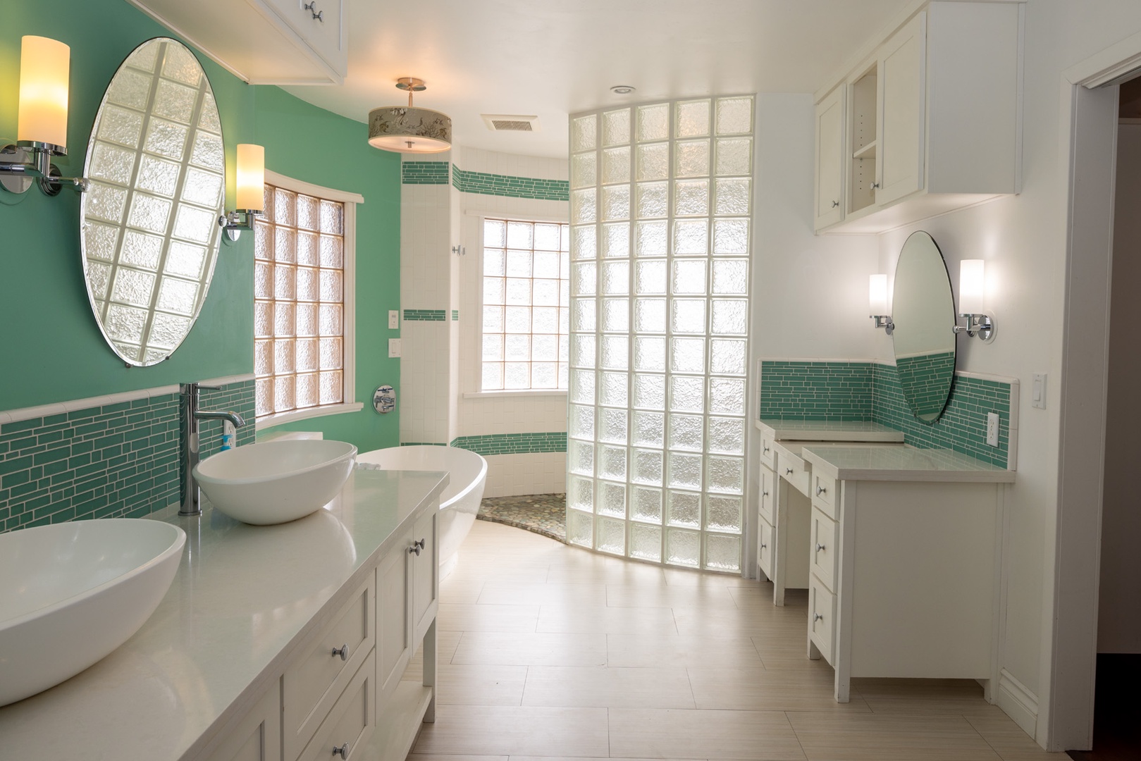 The primary bathroom has a beautiful freestanding tub and a walk in shower