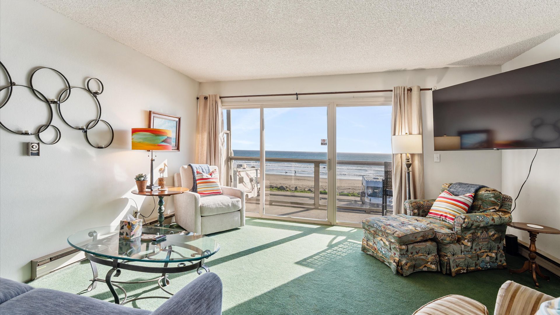 Unwind in the bright living room with ocean views through floor-to-ceiling windows