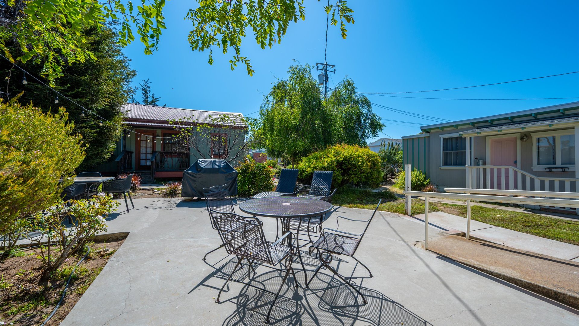 Out the back of the main home is the patio area and large open back yard with multiple spaces to enjoy